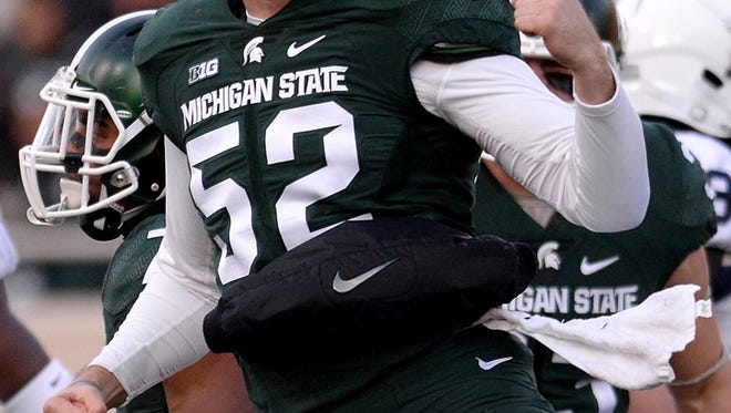 Long Snapper Taybor Pepper (52) celebrates a tackle on a punt during the first half against Penn State Saturday, November 28, 2015, at Spartan Stadium in East Lansing.
