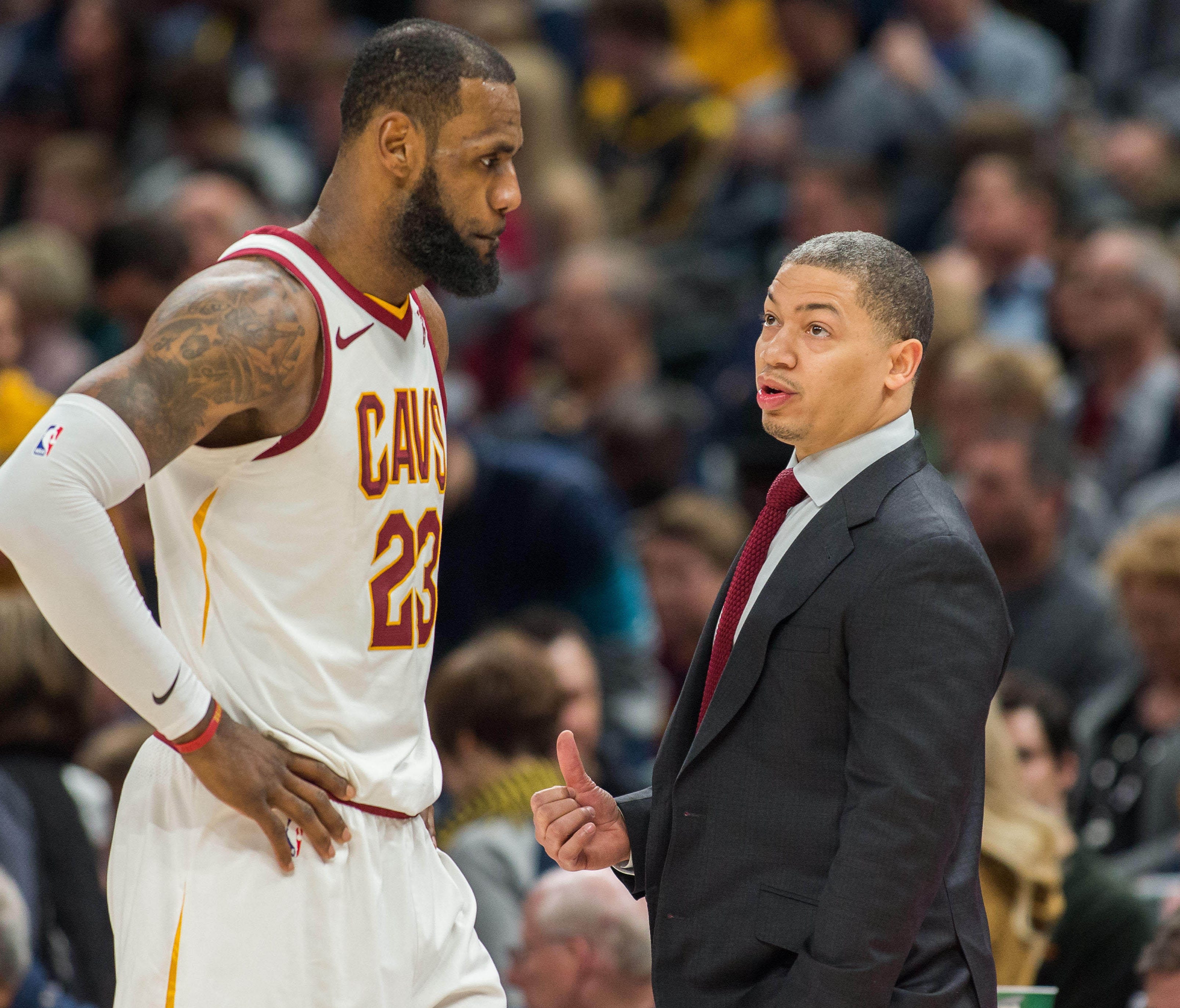 Cleveland Cavaliers forward LeBron James (23) and head coach Tyronn Lue talk during a time out in the second half against the Indiana Pacers at Bankers Life Fieldhouse.