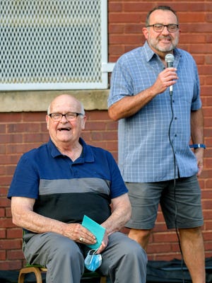 Peoria city councilman Tim Riggenbach, right, draws a laugh out of Jim Combs during a retirement ceremony Wednesday, Sept. 16, 2020 honoring Combs at the East Bluff Community Center. Combs is stepping down after a dozen years as director of the center.
