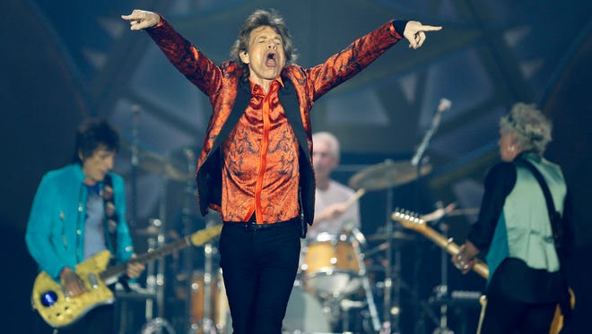 THE PHOTO: Rolling Stones lead singer Mick Jagger gets the crowd going during their "Zip Code" tour at Ralph Wilson Stadium in Buffalo. FROM CARLOS: I could’ve never imagined when I saw the Stones in Madrid during the summer of 1982, that thirty three years later they would be rolling in front of my camera while working as a photojournalist. When covering a major live performance as news photographers, we are usually allowed to shoot the first two or three songs and in this case I had to come up with a photo gallery from the first two. I can say that despite the limited timeframe and the space constraint, every second was a precious opportunity to turn one of the backgrounds of my youth into memories I will forever carry.