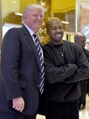 A tremendous photo op: Donald Trump and Kanye West mug for the cameras following their meeting at Trump Tower.