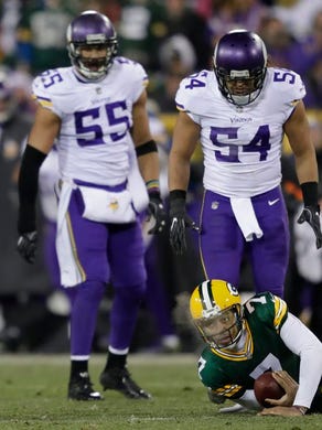 Green Bay Packers quarterback Brett Hundley (7) is stopped on third down forcing a punt in the third quarter against Minnesota Vikings outside linebacker Anthony Barr (55) and middle linebacker Eric Kendricks (54) Saturday, December 23, 2017, at Lambeau Field in Green Bay, Wis.