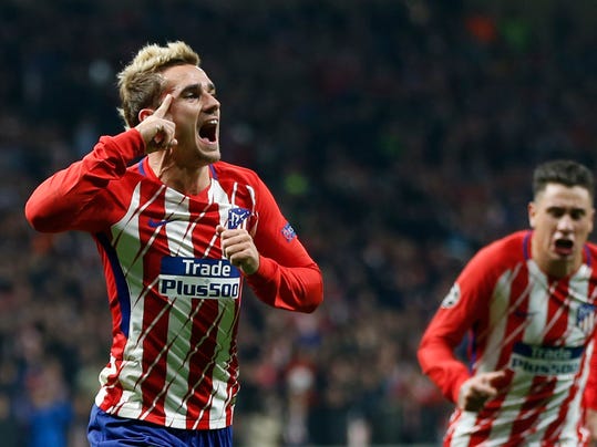 Atletico's Antoine Griezmann celebrates scoring the opening goal during a Champions League group C soccer match between Atletico Madrid and Roma at the Wanda Metropolitano stadium in Madrid, Wednesday, Nov. 22, 2017. (AP Photo/Francisco Seco)
