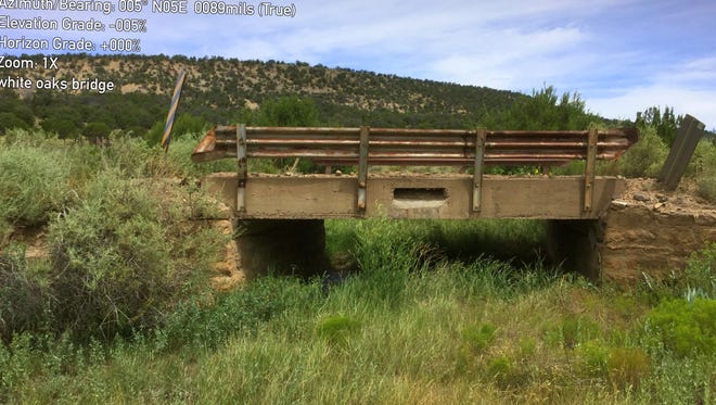 One of several old bridges leading to White Oaks through the national forest could become the county's responsibility to maintain.