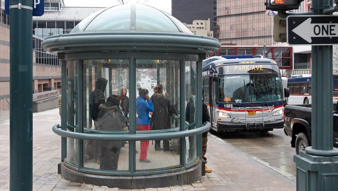 A RTS bus pulls up to a bus shelter on East Main Street. Customers at a public hearing Thursday questioned proposed changes in the system’s routes and schedules.