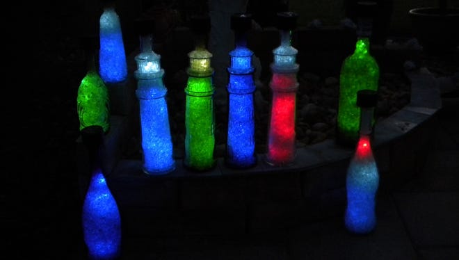 Bob Tilbe of Del Monte Court in Cape Coral sent in this picture of a variety of bottles that have been equipped with solar power and LEDs, so that after dark they light up and “glow.”