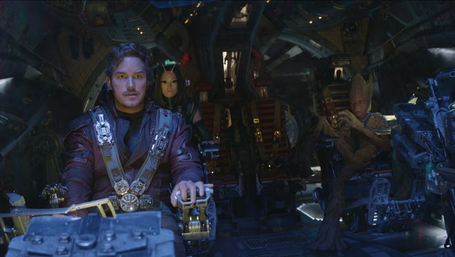 Star-Lord/Peter Quill (Chris Pratt), Mantis (Pom Klementieff) and Groot (voiced by Vin Diesel) take on Thanos (Josh Brolin) in 'Infinity War.'