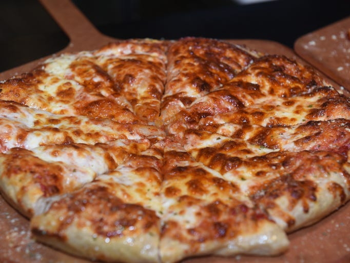Cheese pizza at Four Story Burger.