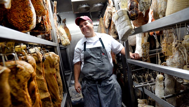 Anthony Gray, Bacon Bros. Public House executive chef, poses for a portrait inside of their curing room at the restaurant on Wednesday, September 17, 2014.