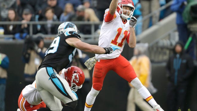 Kansas City Chiefs' Alex Smith (11) throws a pass as Carolina Panthers' Luke Kuechly (59) closes in during the first half of an NFL football game in Charlotte, N.C., Sunday, Nov. 13, 2016. (AP Photo/Bob Leverone)