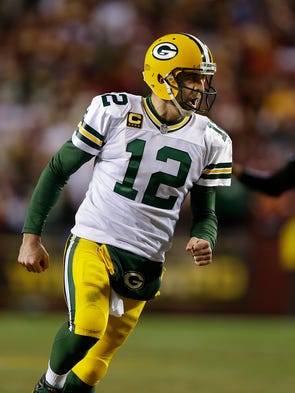 Green Bay Packers quarterback Aaron Rodgers (12) celebrates