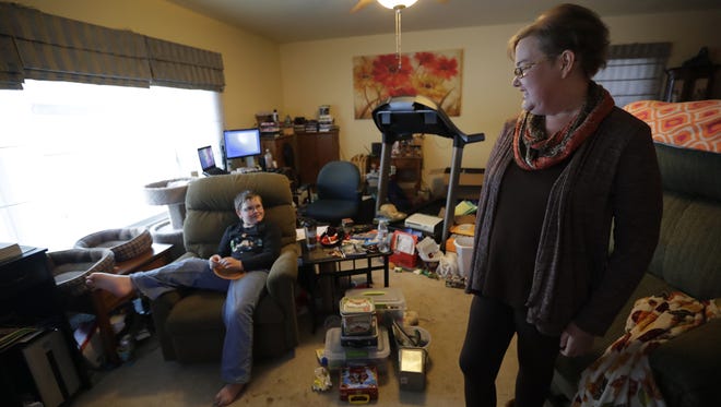 April Miron talks with her son, Holden, 9, at their home in Chilton.  "I want to see him grow up, I want to see him get married," she says of the heart transplant that promises to extend her life.