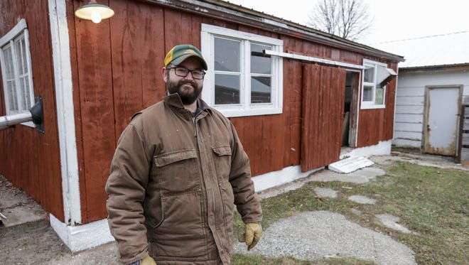 Matt Havlovitz stands in front of one of the original barns on his farm Friday, Dec. 8, 2017, in Mishicot, Wis. Many of the barns on the property are more than 100 years old. Josh Clark/USA TODAY NETWORK-Wisconsin