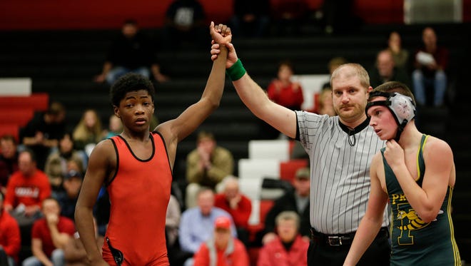 Manitowoc Lincoln's Demario Ford wins his match against Green Bay Preble's Connor Derenne on Jan. 11. Ford is 27-8 at 106 pounds.