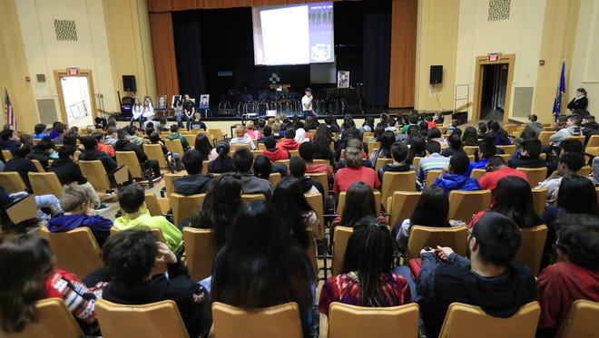 Eighth graders listen to an anti-bullying presentation in the auditorium at Washington Middle School on Monday in Green Bay.