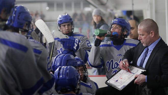 Notre Dame head coach Cory McCracken talks to his team during a timeout in the 3rd period against Neenah in a WIAA hockey sectional final at the Cornerstone Community Center in February.