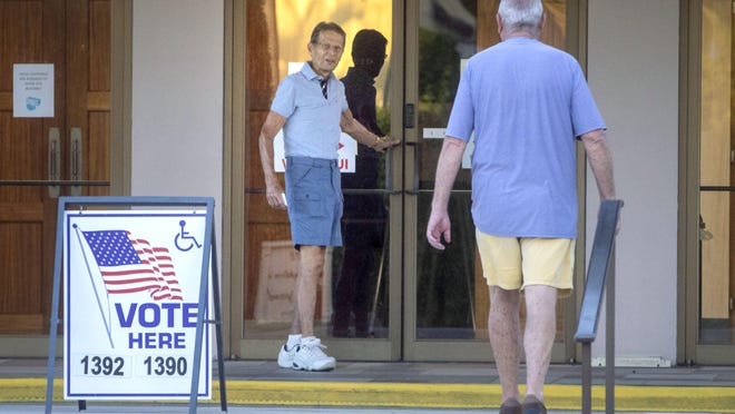 A small number of people, mostly seniors, trickled into the St. Edward Parish Center to cast their votes not long after 7 a.m. when the polling stations opened in Palm Beach on Tuesday.