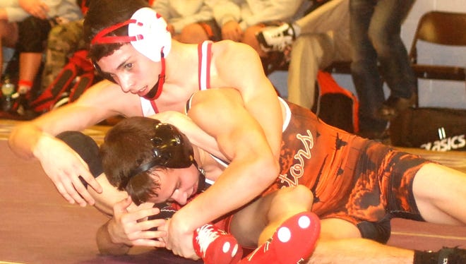 Hasbrouck Heights' Ian Rink (top) holding down Pompton Lakes' Nick Secor in the 126-pound bout Jan. 25.