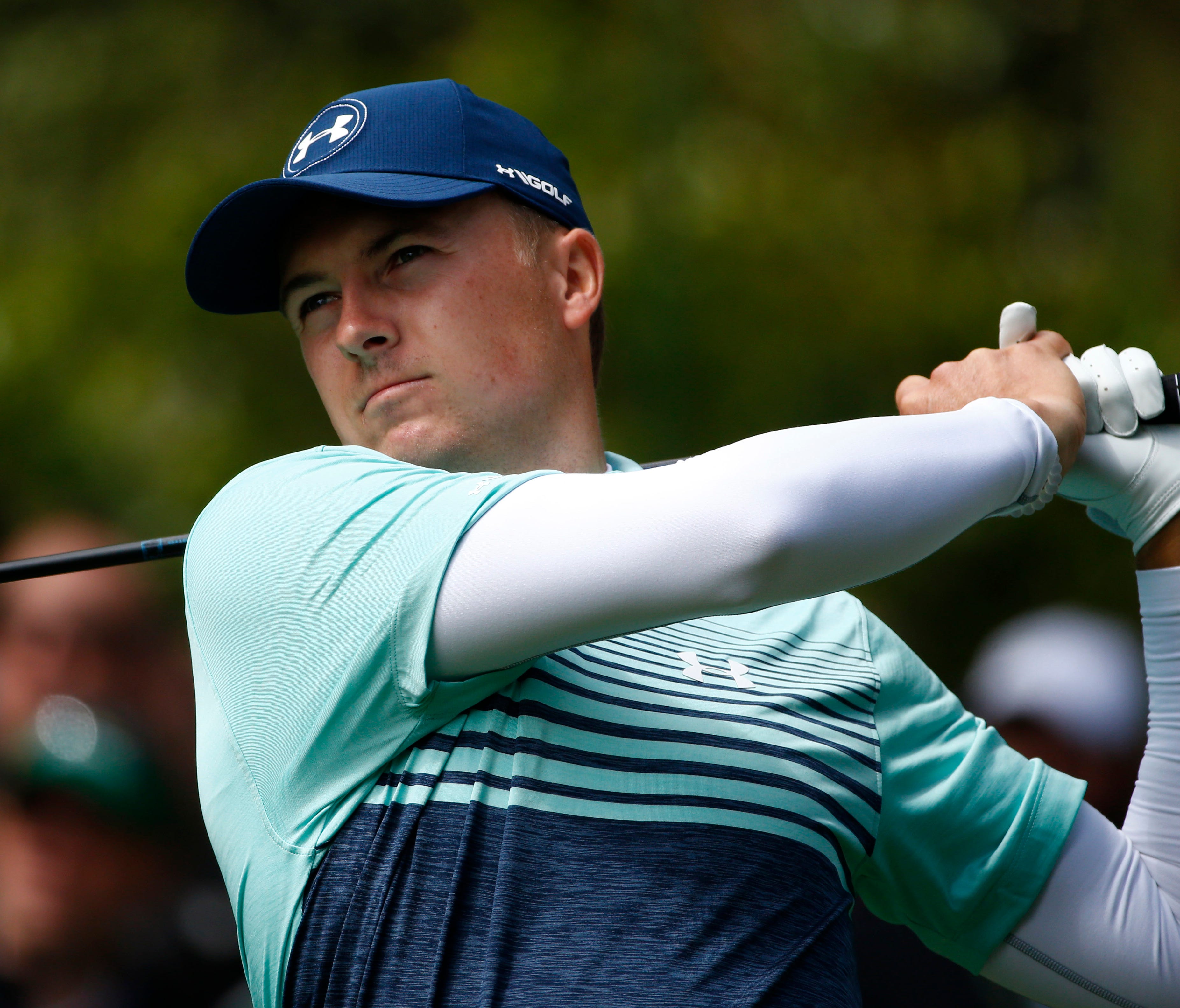 Jordan Spieth hits his tee shot on the 7th hole during the first round of the Masters at Augusta National Golf Club on April 6.