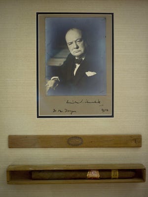 A cigar and signed photo of Winston S. Churchill that was presented to his children's nanny is on display at Raptis Rare Books.