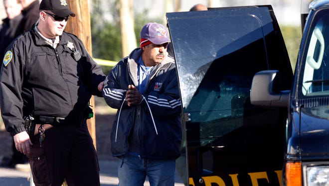 Maricopa County Sheriff's deputies conduct workplace raid.