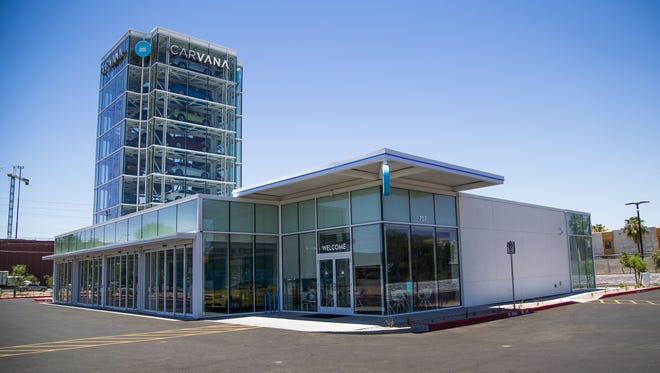 Carvana, a unique car-vending machine and online automotive retailer, at Rural Road and the Loop 202 in Tempe. Cars are stacked in a transparent tower and are brought down to ground level by machines after a buyer puts a coin in a receptacle.