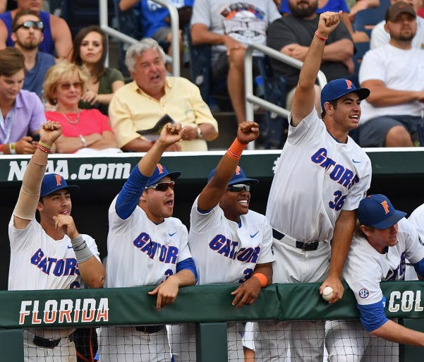Florida players celebrate a hit against LSU in Game 2 of the College World Series.