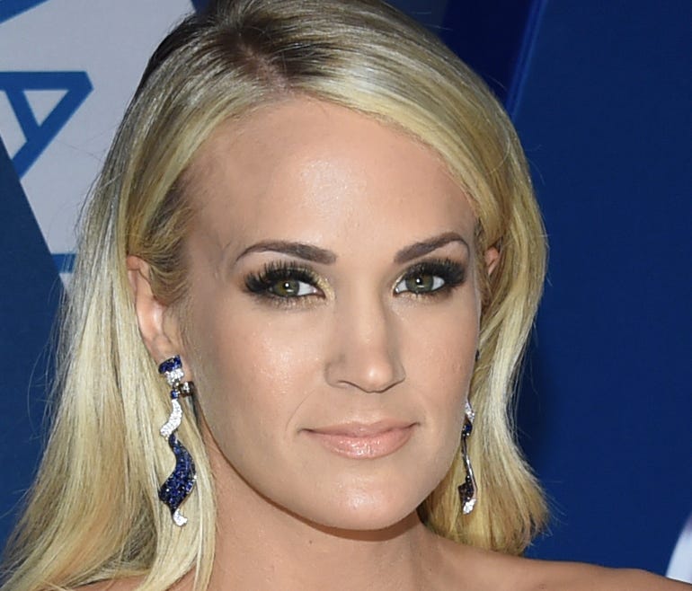 Country music's biggest stars turned up the fashion heat on the red carpet for the Country Music Association Awards Wednesday. Click ahead to see the hottest looks. Carrie Underwood hits the red carpet in Nashville.