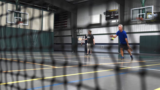 Tim Stokes serves while playing pickleball at Kids America in Coshocton recently.