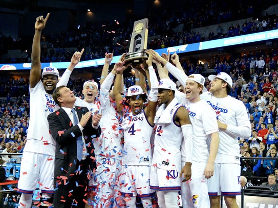 Bill Self and the Jayhawks celebrate their Midwest