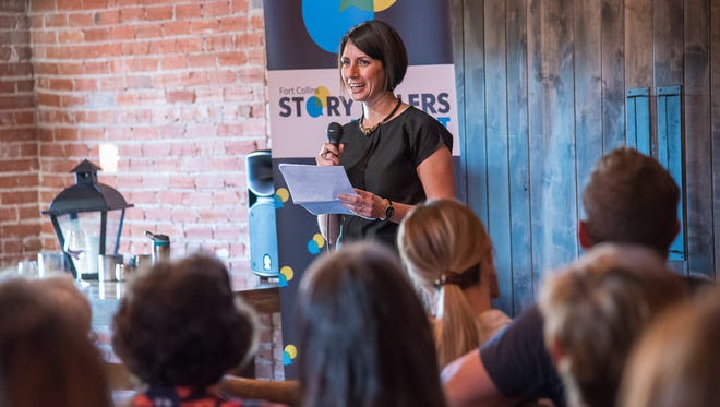 Carolin Aronis tells her story on reconnecting with home through food during the Coloradoan Storytellers Project at Ginger and Baker on Wednesday, May 16, 2018.