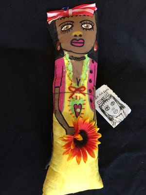 Each of Della Wells' handcrafted dolls comes with a handmade booklet.