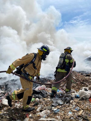 Firefighters respond to a fire on top of the South Carver landfill. [Photo courtesy of the Carver Fire Photo Team