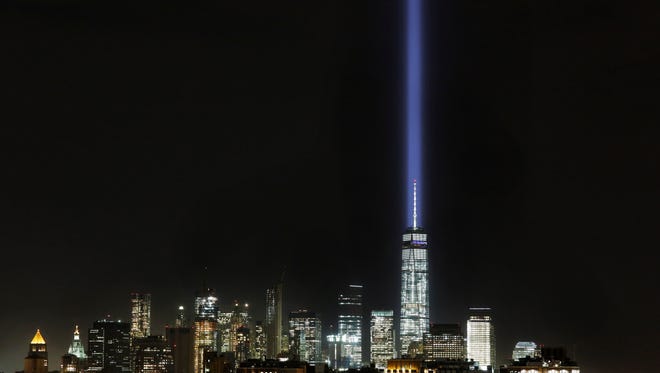 The Tribute in Light illuminates the sky behind One World Trade Center and the lower Manhattan skyline, Wednesday in New York. Friday marked the fourteenth anniversary of the terrorist attacks of Sept. 11 on the United States.