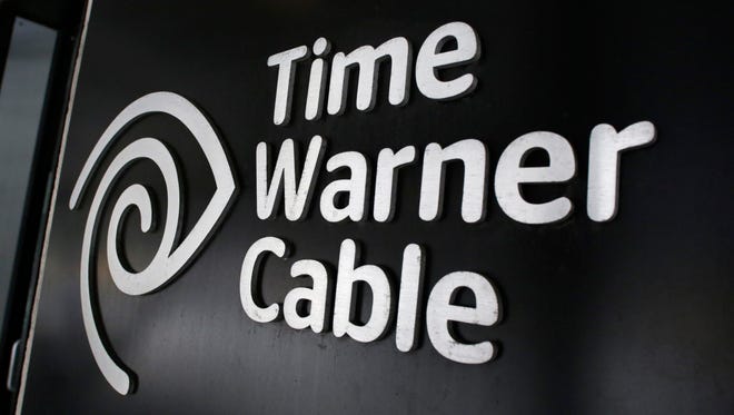The Time Warner Cable corporate logo is displayed at a company store in New York.