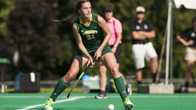 Vermont's Lauren Tucker (21) looks to pass the ball during the women's field hockey game between the Holy Cross Crusaders and the Vermont Catamounts at Moulton Winder Field on Wednesday afternoon in Burlington.