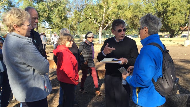 Palm Springs Mayor Rob Moon, second from right, meets with residents at the city dog park Tuesday. Many dog owners would like more amenities at the 1.6-acre park.