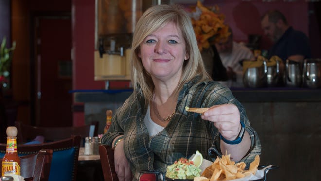 Connie Correia is still hoping the Food Network will want to send "Diners, Drive-Ins and Dives'' to The Pop Shop. She's shown here enjoying nachos at Tortilla Press.