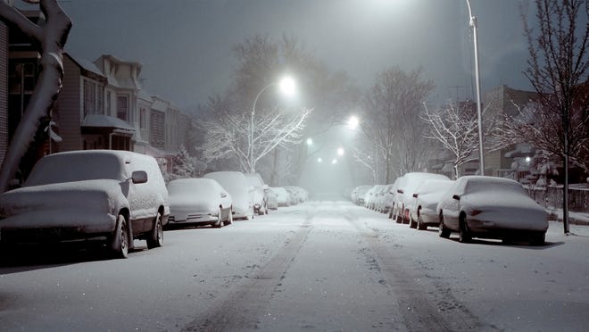 Snow-covered cars.