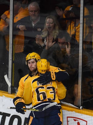 Predators forward Filip Forsberg is congratulated by teammate Mike Riberio (63) after scoring in the first period Saturday.