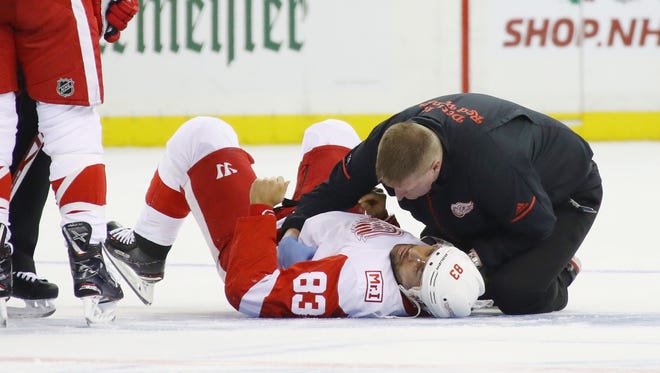 Red Wings defenseman Trevor Daley is attended to after an injury during the first period on Friday, Nov. 24, 2017, in New York.