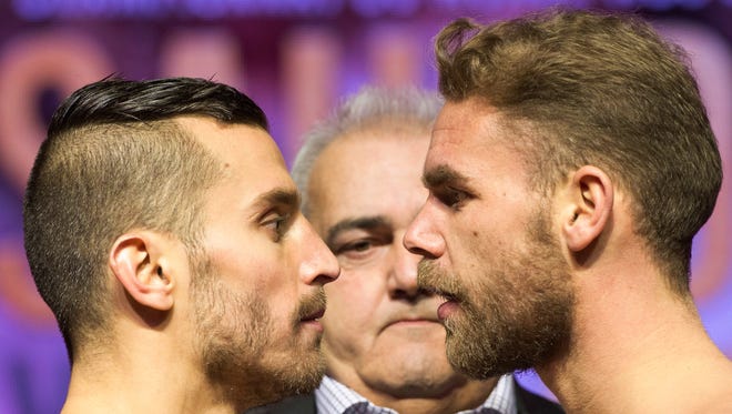 David Lemieux, left, and Billy Joe Saunders face off after their weigh-in Friday.