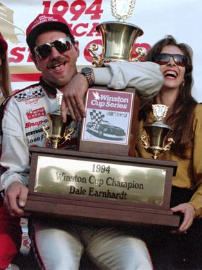 Dale Earnhardt, celebrating his final title with his
