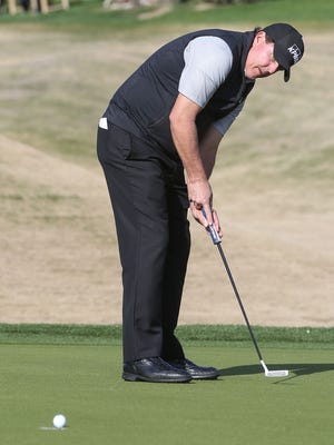 Phil Mickelson sinks an eagle putt on the 11th hole at the Jack Nicklaus Tournament Course at PGA West during the CareerBuilder Challenge, January 20, 2016. 