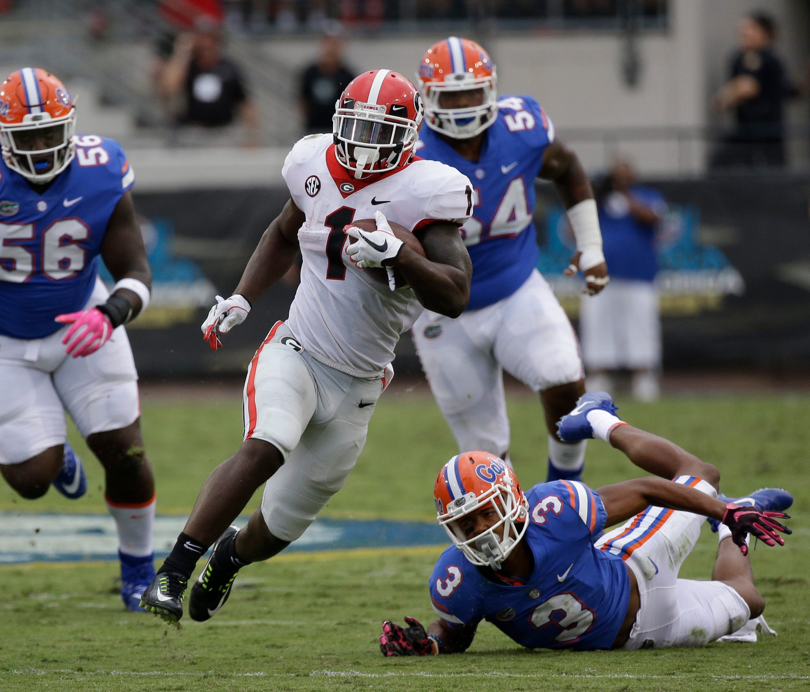 Georgia's Sony Michel runs past Florida defenders for a 45-yard touchdown.