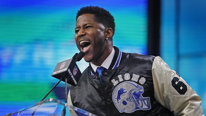 Nate Burleson gets the crowd fired up before announcing the Lions' pick, Auburn running back Kerryon Johnson, in the second round Friday in Arlington, Texas.