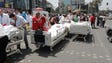 Patients at a hospital receive medical treatment outside