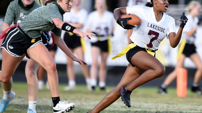 Lakeside's Langsten Lilly breaks away to score a touchdown for Lakeside during flag football action at Greenbrier High School in Evans, Ga., Thursday evening November 5, 2020.