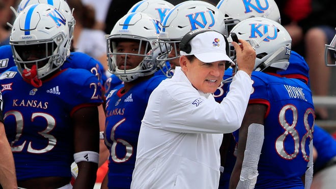 Kansas head coach Les Miles works the sidelines during the first half of an NCAA college football game against West Virginia in Lawrence, Kan., Saturday, Sept. 21, 2019. (AP Photo/Orlin Wagner)