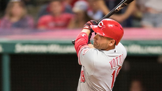Cincinnati Reds first baseman Joey Votto (19) hits a three-run double during the ninth inning against the Cleveland Indians at Progressive Field.